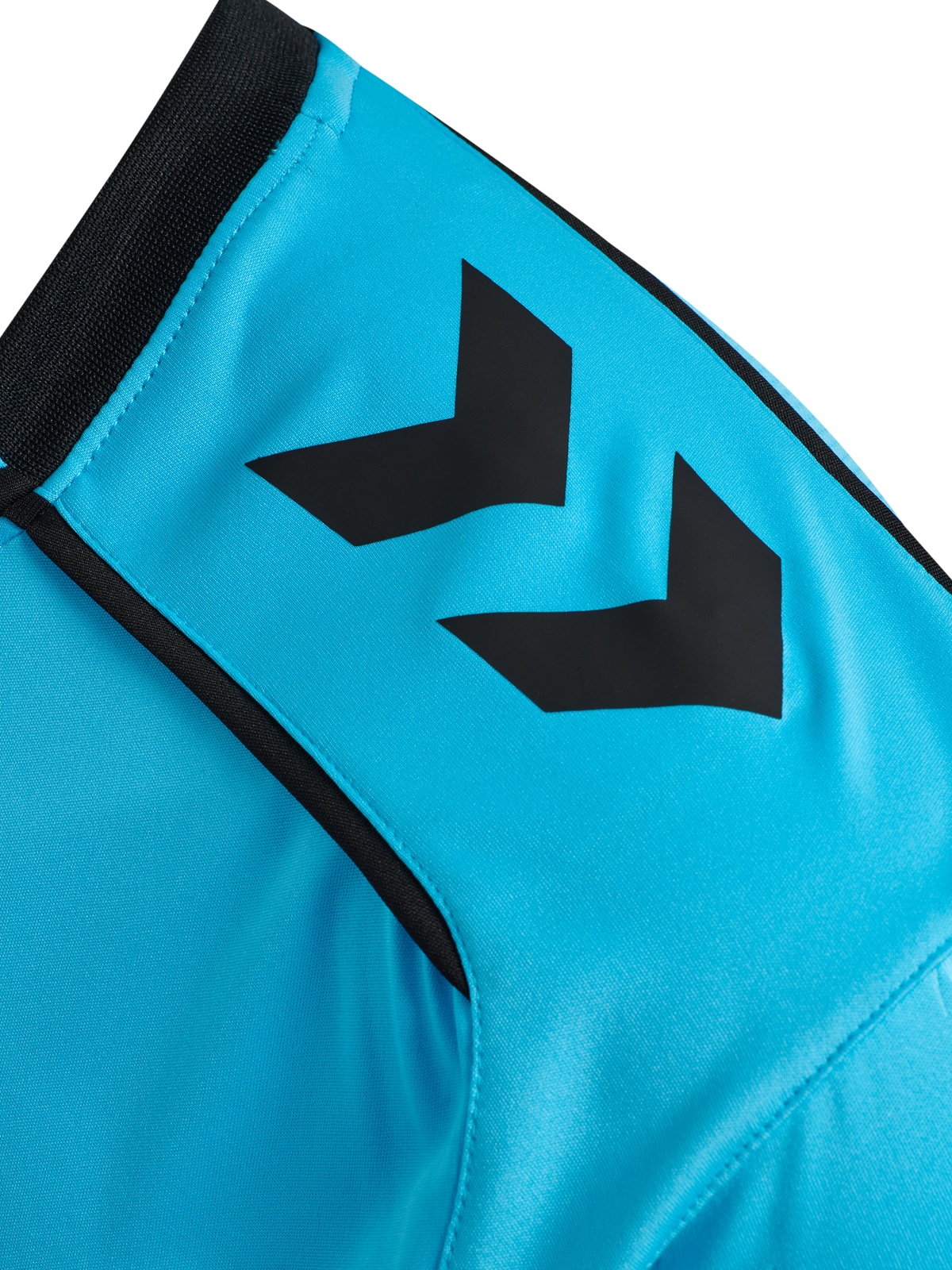 Close-up of the Hummel chevron sleeve detail on the blue Hummel 2026 referee shirt