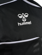 Close-up of the Hummel logo and chest pocket on the black Hummel 2026 referee shirt