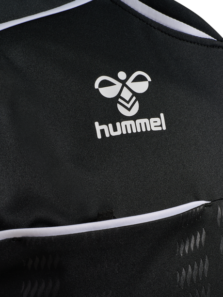 Close-up of the Hummel logo and chest pocket on the black Hummel 2026 referee shirt