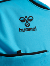 Close-up of the Hummel logo and chest pocket on the blue Hummel 2026 referee shirt