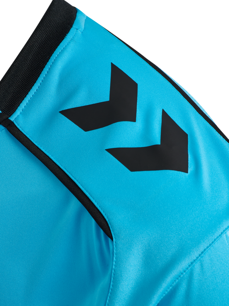 Close-up of the Hummel chevron sleeve detail on the blue Hummel 2026 referee shirt
