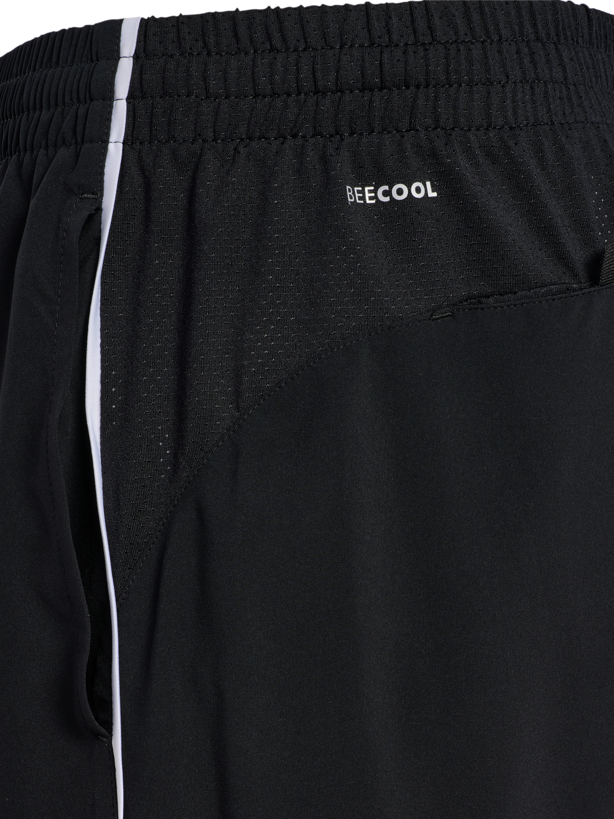 Close-up of the side panel and white piping on black Hummel 2026 referee shorts