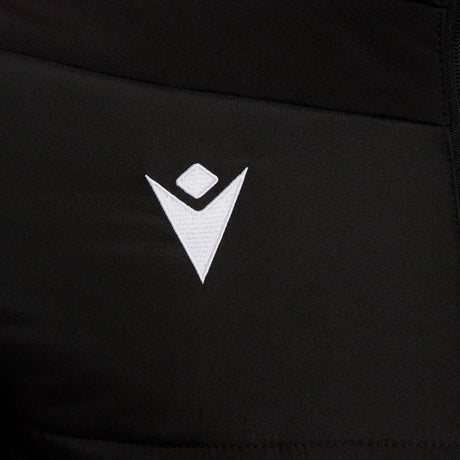 Close-up of the Macron logo on the black Macron referee winter jacket