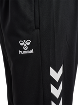 Close-up of the Hummel logo and chevrons on black Hummel referee training pants