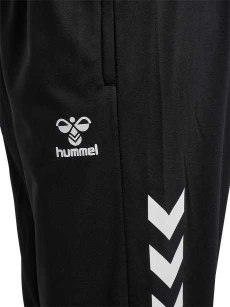Close-up of the Hummel logo and chevrons on black Hummel referee training pants