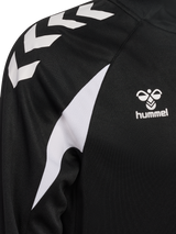 Close-up of the Hummel logo and chevron sleeve on the black Hummel referee 1/4-zip midlayer