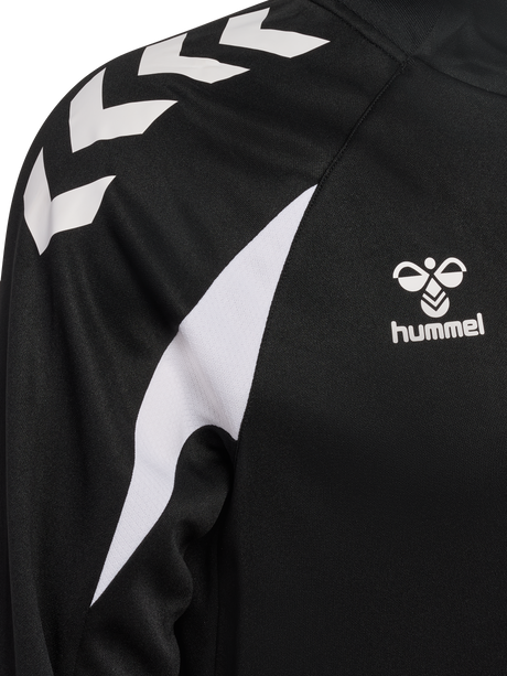 Close-up of the Hummel logo and chevron sleeve on the black Hummel referee 1/4-zip midlayer