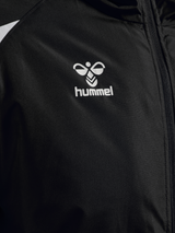 Close-up of the Hummel logo on the black Hummel referee winter coat