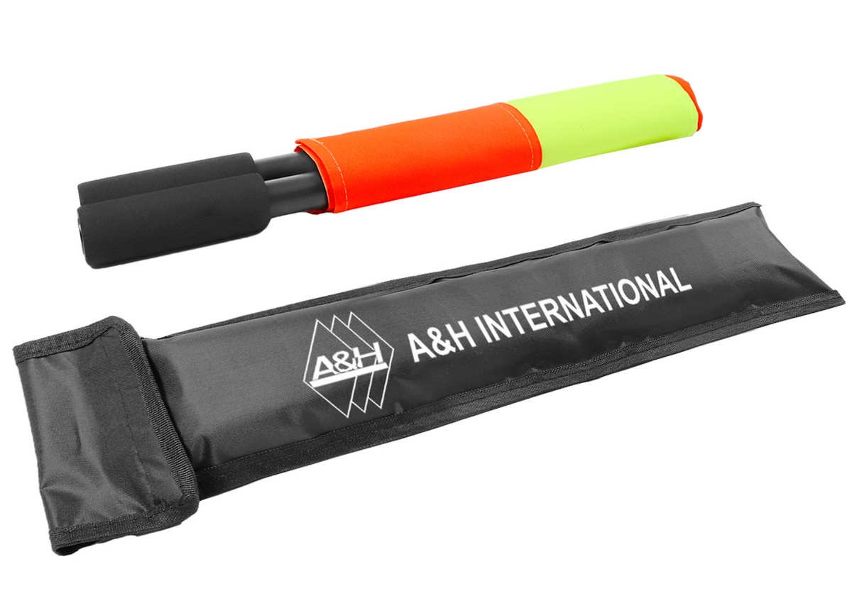A&H referee flag rolled up next to its grey A&H International carry case