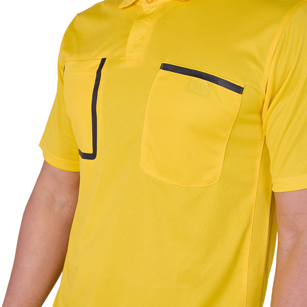 Referee wearing the A&H yellow referee shirt, close-up of the chest pockets
