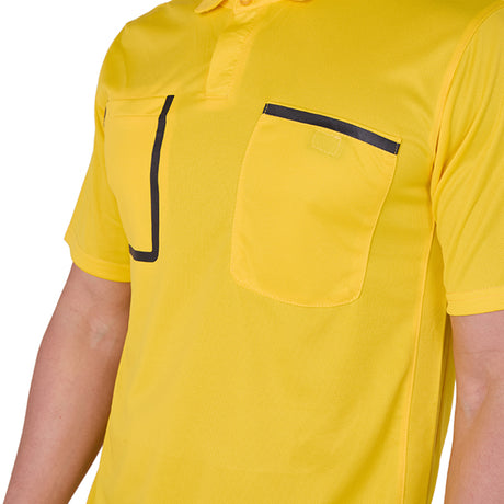 Referee wearing the A&H yellow referee shirt, close-up of the chest pockets