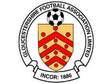 Gloucestershire FA referee badge: red and gold shield with a football, dated 1886