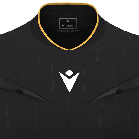Close-up of the gold-trimmed collar and Macron logo on the black Macron Mendez referee shirt