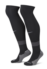 Pair of black Nike referee socks with grey heel and toe, side view