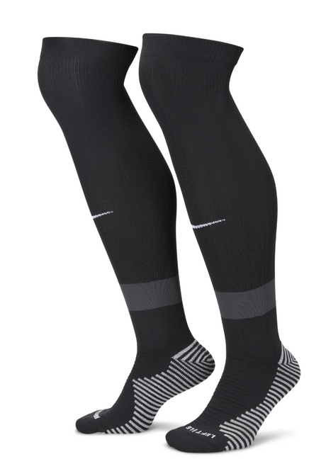 Pair of black Nike referee socks with grey heel and toe, side view