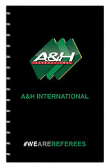 A&H referee match day notebook with green A&H logo and #WeAreReferees on the cover