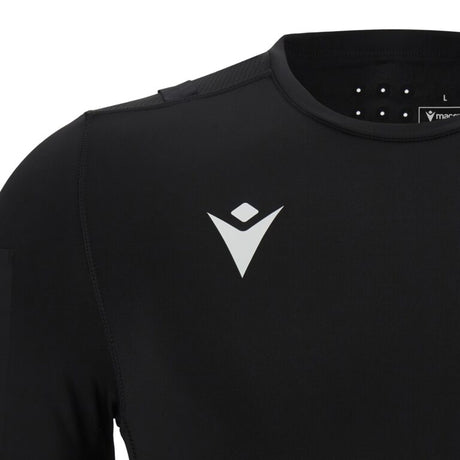 Close-up of the Macron logo on the black Macron UEFA referee base layer