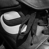 Close-up of the laces and tongue on the Umpiro Pro black referee shoe