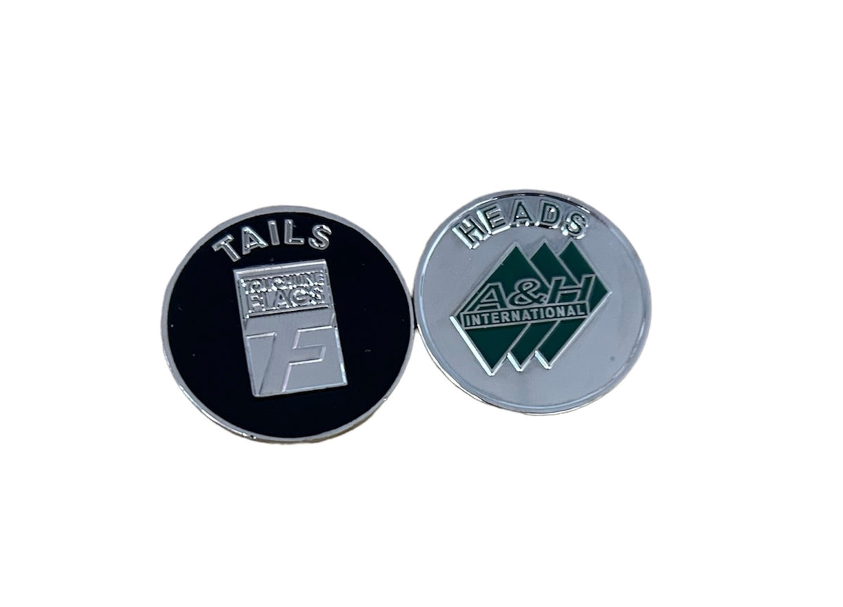 A&H metal flip coin showing both heads and tails sides