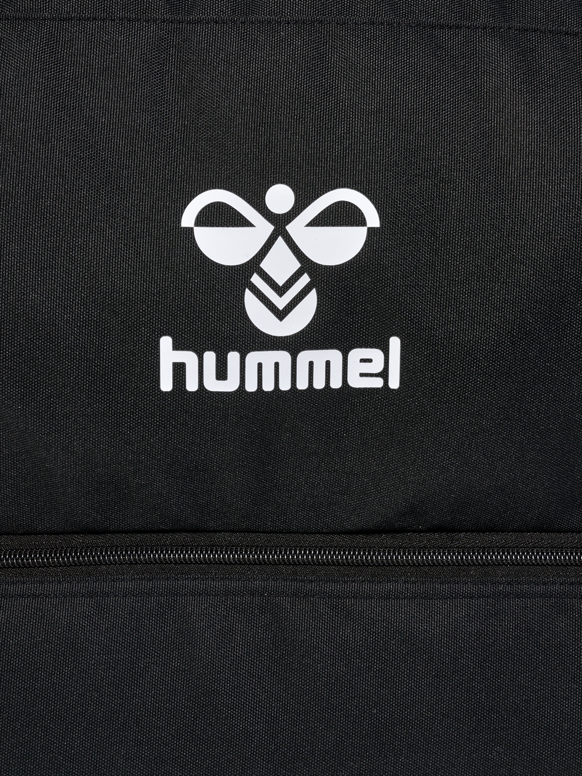 Close-up of the white Hummel logo on the black Hummel referee bag