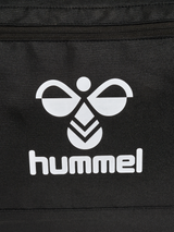 Close-up of the white Hummel logo on the black Hummel roller bag