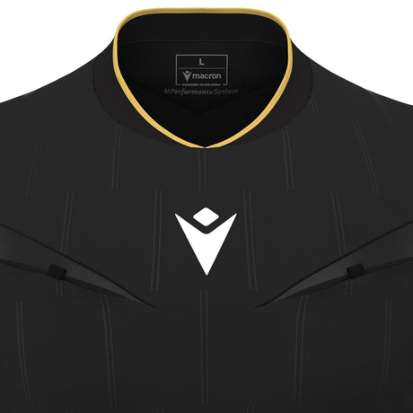Close-up of the gold-trimmed collar and Macron logo on the black Macron Mendez referee shirt