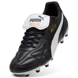 Puma King Top black leather football boot, angled view of the fold-over tongue