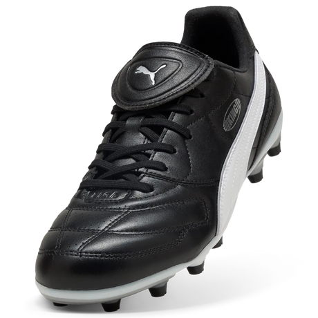 Puma Liga black leather football boot, angled view of the fold-over tongue