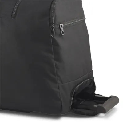 Puma black roller bag, close-up of the wheels and base compartment
